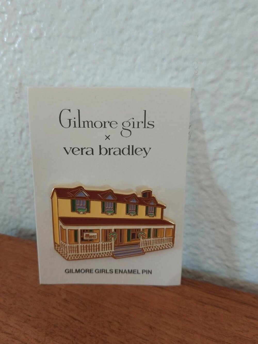 Gilmore Girls x Vera Bradley enamel pin featuring the yellow house with brown ro